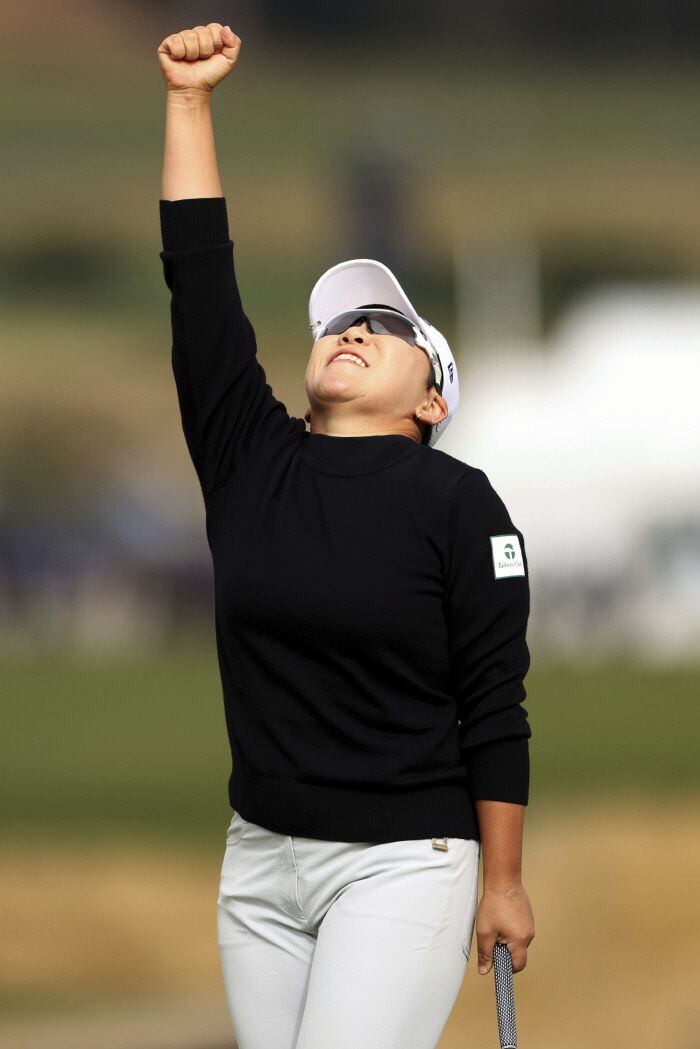 Jiyai Shin, of South Korea, reacts on the 18th green after sinking a birdie putt to tie for second place in he U.S. Women's Open golf tournament at the Pebble Beach Golf Links, Sunday, July 9, 2023, in Pebble Beach, Calif. (Scott Strazzante