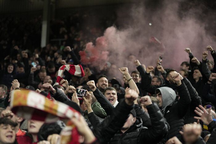 Liverpool's fans celebrate after the end of the English League Cup semi final second leg soccer match between Fulham and Liverpool, at Craven Cottage stadium in London, England, Wednesday, Jan. 24, 2024. The game ended 1-1. (AP Photo
