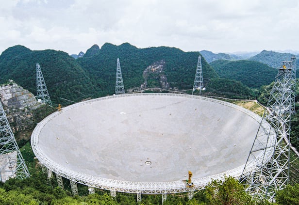 The 500-meter aperture spherical radio telescope 'FAST' in Guizhou Province, China. /Wikimedia Commons