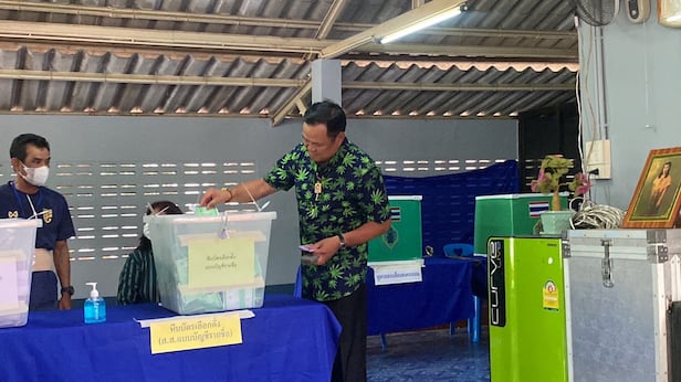 During the 2023 Thai general election, Prime Minister Anutin Charnvirakul votes while wearing a shirt with a cannabis drawing. /Reuters-Yonhap
