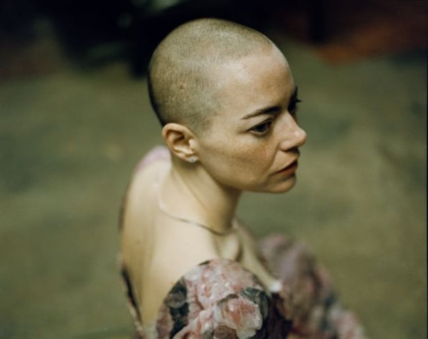 Emma Stone's Shaved Head, Flower Dress in 'Bugonia' Stills