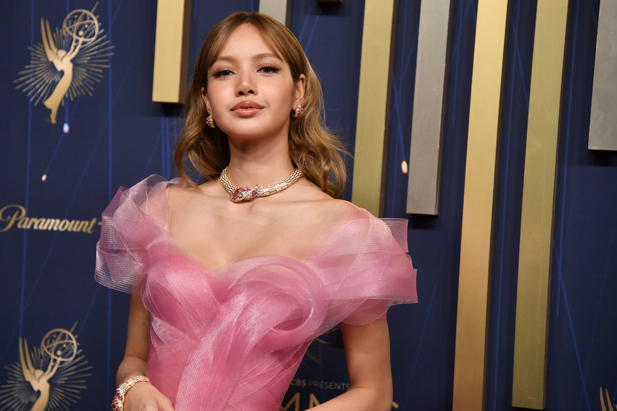 lisa emmy dress designer Lisa has made her Emmys debut a candy pink gown by @lever_couture that swirled around her body and extended into a dramatic train as she made her way down the carpet. Her look was accented with
